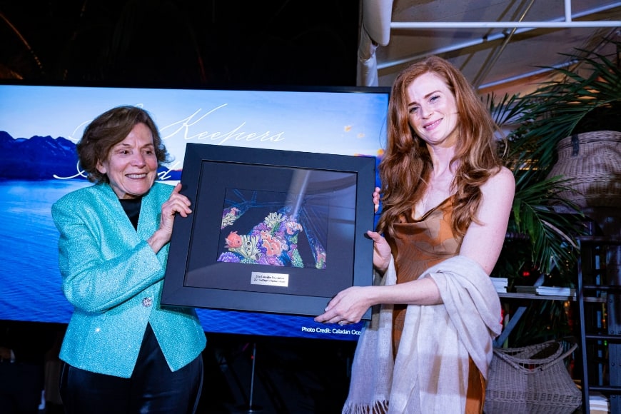 Sylvia A. Earle & Amber Sparks holding up the NextGen Award